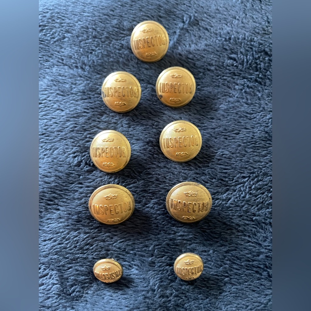 Vintage “Inspector” buttons. 7 large and 2 small.